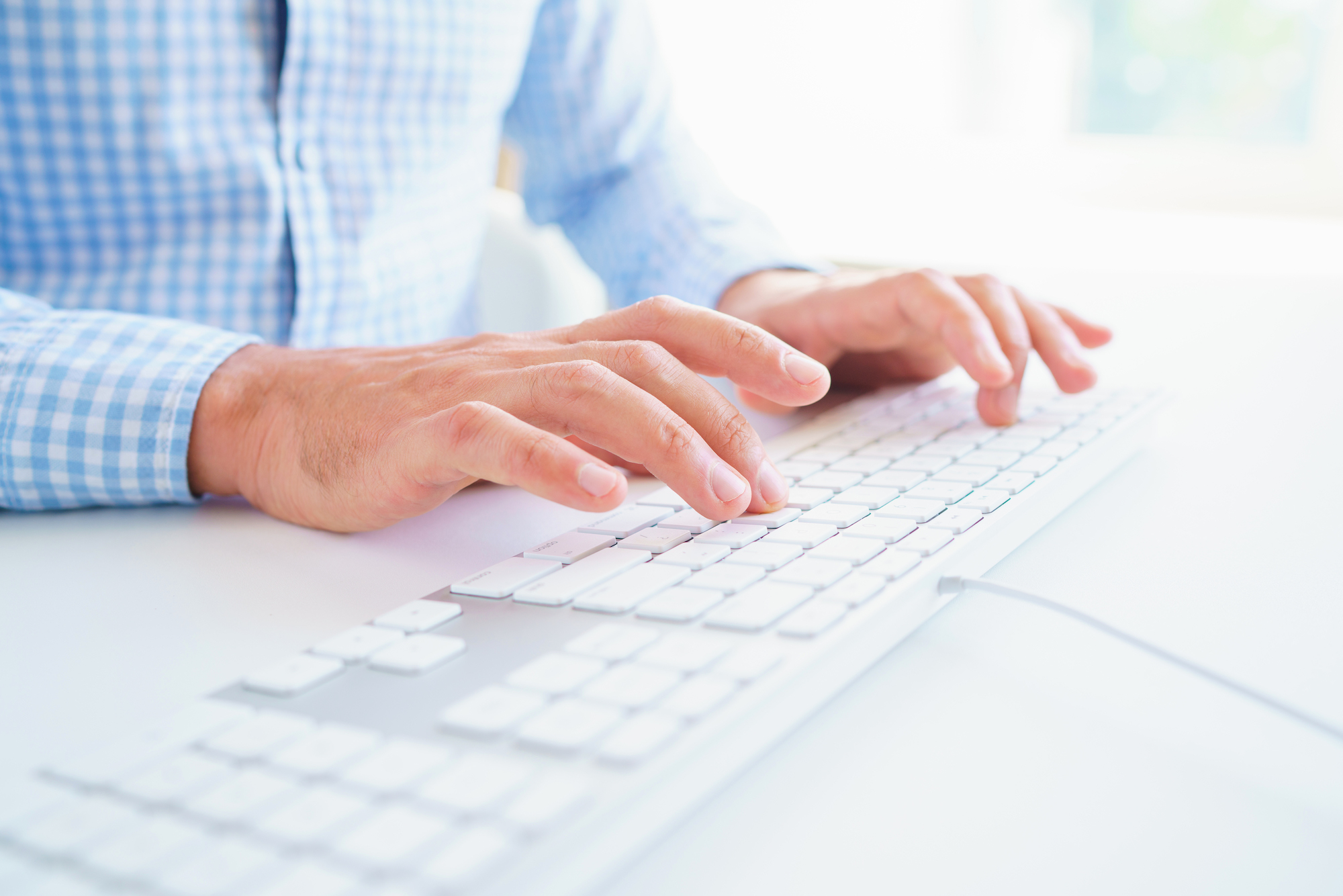 Men office worker typing on the keyboard